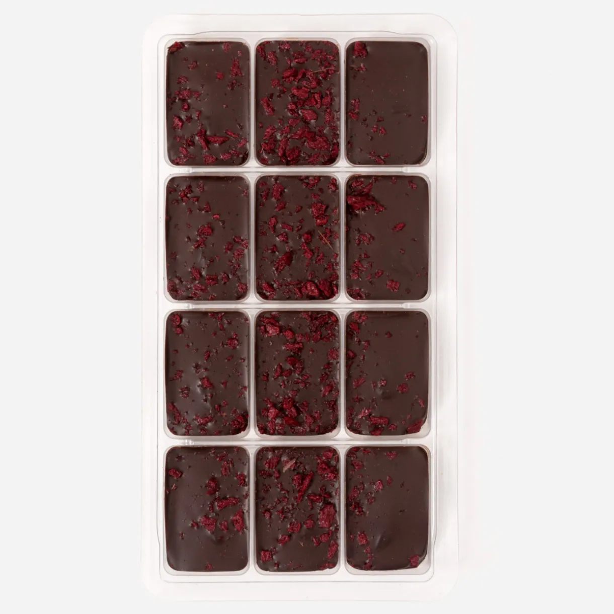 Chocolats noirs fourrés à la framboise et au fruit de la passion