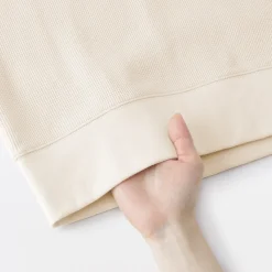 Pull à col rond en coton biologique tricoté gaufré pour femme