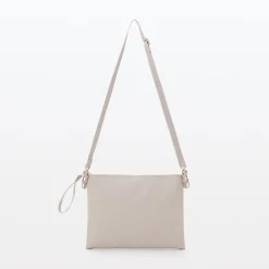 Sacoche à bandoulière déperlante détachable.
